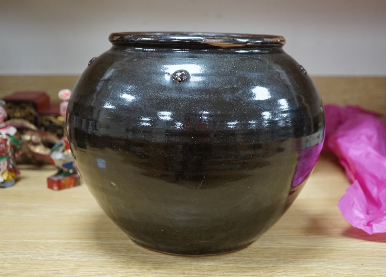 A Chinese Henan black glazed jar, Song dynasty, 23cm high. Condition - some glazing missing in manufacturing